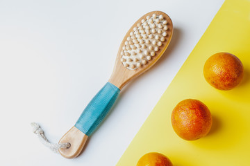 Anti-cellulite massage brush on a white background. Orange peel cellulite concept. Lymphatic drainage massage. Place for text. organic cactus brush