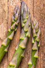 Raw Asparagus Tips on a cutting board