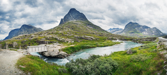 Naklejka na ściany i meble Norway troll road in summer. Norwegian beautiful nature and nordic typical mountain river landscape in Trollstigen