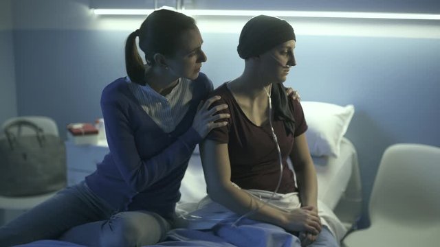 Woman comforting her friend at the hospital