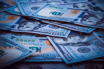 The background of a one hundred dollar bill. Style blue light.