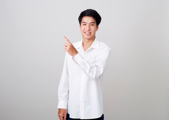 young asian handsome businessman on wall