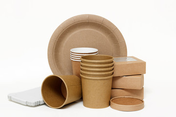Eco kraft paper tableware. Paper cups, dishes, fast food containers, paper napkins isolated on white background. Recycling concept. Zero waste.