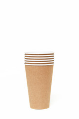Eco kraft paper tableware. Paper cups isolated on a white background. Recycling concept. Zero waste.
