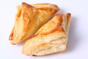 Fresh and tasty croissant over white background