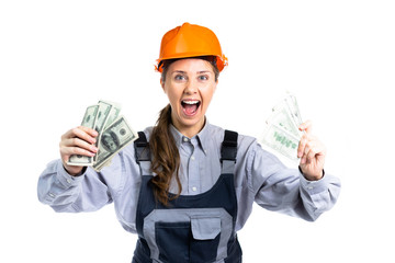 Builder engineer girl with money in her hand rejoices in so many dollars. Isolated