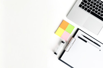 Coaching business tools like hourglass, notebok, pens and tablet on a white wooden background. Flat lay compositions, space for text.