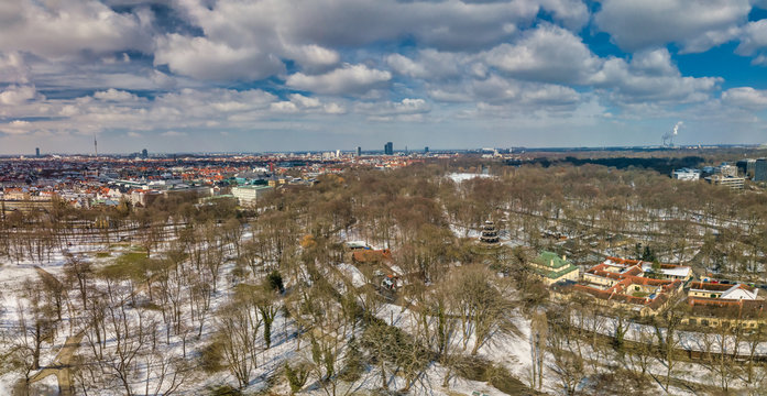 Panoramic winter aerial, snowy munich at the Englischer Garten with the Chinese Turm.