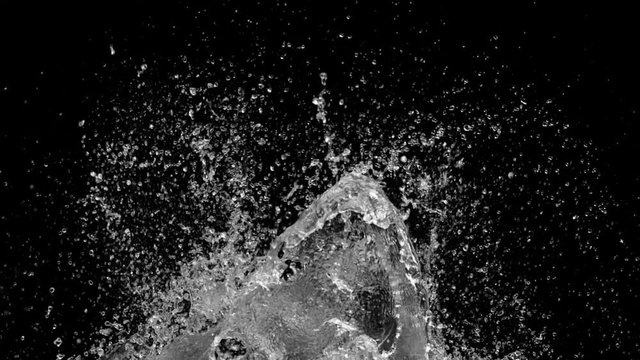 Slow motion of water splash abstract particle on black background