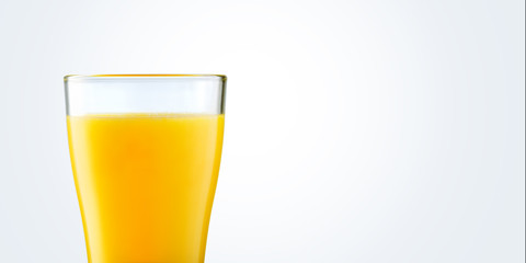 Orange juice in glass on gray background with copy space. Concept summer drink.