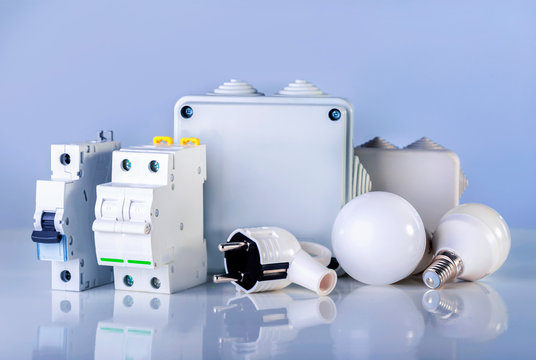 Electrical Equipment On Blue Background. Various Electric Products On The Store Shelve.