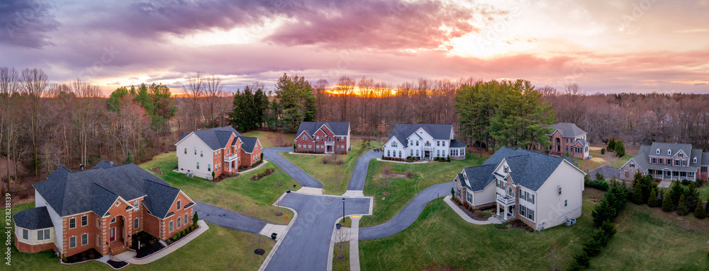 Wall mural aerial sunset panorama of brick facade luxury mansion type single family homes neighborhood cul-de-s