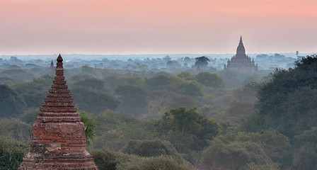 Scenic and stunning sunrise at Archaeological Zone over Bagan in Myanmar. Bagan is an ancient city...