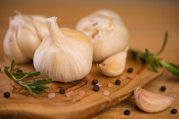 garlic and drunkenness on a wooden background, food and cooking saver, recipe book
