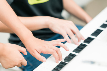 Playing the piano with both hands