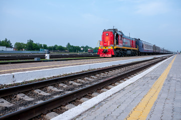Fototapeta na wymiar Russia, Blagoveshchensk, July 2019: train on railway tracks in summer