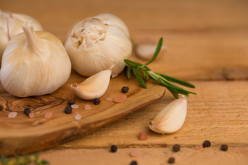 garlic and drunkenness on a wooden background, food and cooking saver, recipe book