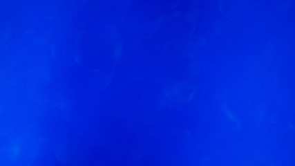 Blurred abstract photo of light burst and glitter golden bokeh lights.  