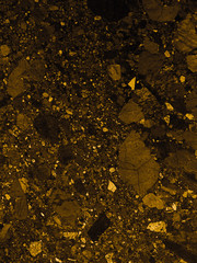 Beautiful closeup textures abstract color dark red and gold granite tiles floor and  flowers orange and red granite rock wall pattern wallpaper and black and yellow tiles floor background