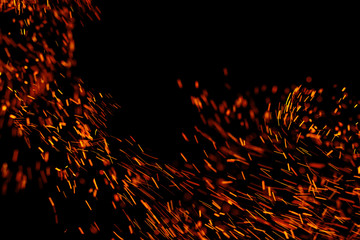 flame of fire with sparks on a black background