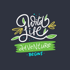 Wild Life Adventure begins lettering phrase and landscape. Modern calligraphy. Isolated on black background.