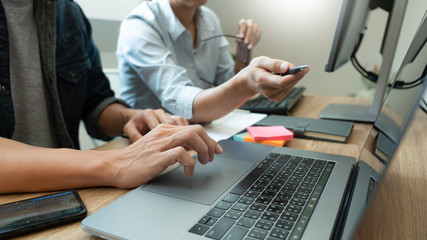 Collaborative work Software engineers website developer technologies or programmer working coding on startup ai application project on screen with partner in coworking space office company.