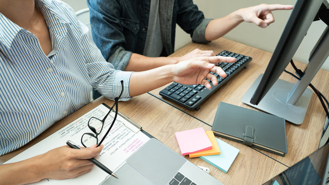 Collaborative work Software engineers website developer technologies or programmer working coding on startup ai application project on screen with partner in coworking space office company.