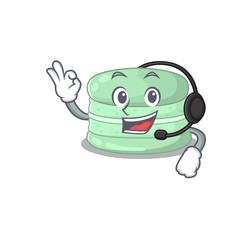 Happy pistachio macaron mascot design style wearing headphone