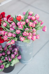 Pink Tulips in a Bucket at a Flower Stand