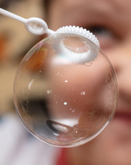 Soap bubble in the hand.