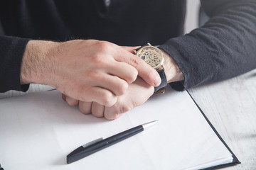 Businessman wearing luxury wristwatch. Fashion, Lifestyle