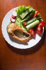 Grilled fish and fresh vegetables