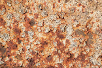 Naklejka premium Wall with severe corrosion. Peeling metal layers by cups. Primary colors - El Salva, Quarter Spanish White.