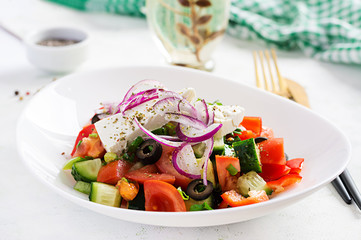 Trendy salad. Greek salad  with fresh vegetables, feta cheese and black olives.  Healthy balanced eating.