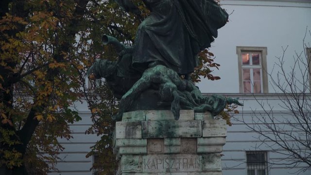 St. John Of Capistrano Statue Situated At The Kapisztran Square In Budapest Hungary - Tilt Down Pan Shot