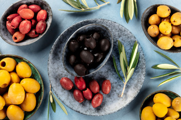 Olives, shot from the top. An assortment of green, black and red olives