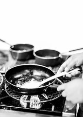 Chef cooking in a kitchen, chef at work, Black & White.