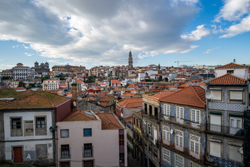 Fototapeta na wymiar Porto, Portugal - Viewpoint of the red clay rooftops and tower of the Clerigos Church (Baroque style church with bell tower) in Porto Portugal