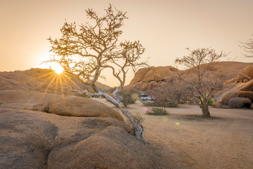 Camping life at sunrise in the Spitzkoppe National Park in Namibia.