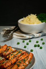 Baked carrots with greens and mashed potatoes.