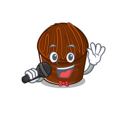 Happy chocolate candy singing on a microphone
