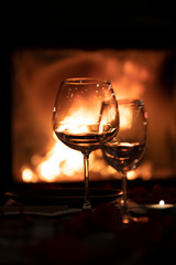 wine glasses on fire background
