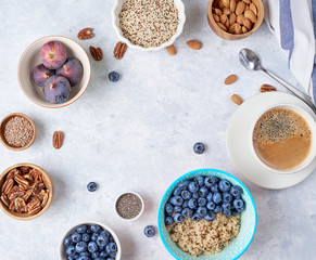 Healthy breakfast of superfoods, quinoa, honey, nuts, figs, coffee. Top view