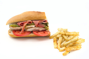 Sandwich Serranito typical in Andalusia with ham, gren pepper and grilled pork loin