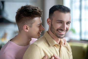 Close up picture of gay couple feeling happy