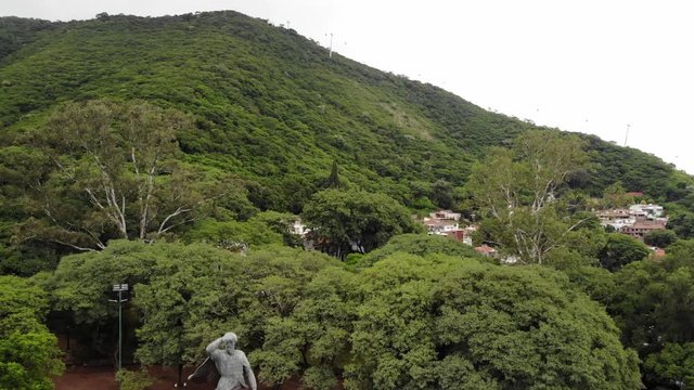 Aerial view of General Mart&iacute;n Miguel de G&uuml;emes monument in Salta, Argentina. Drone slowly descending.