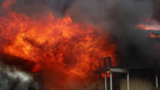 big fire with black smoke aerial top panoramic view sky fly