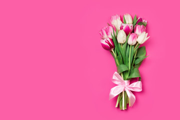 Attractive bouquet of tulips on pink background. Concept of Women's Day, Mother's Day, 8 March, the holiday greetings.