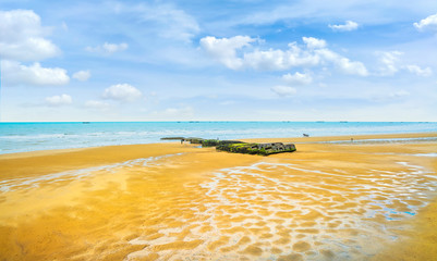 Arromanches les Bains, Beach and remains of the artificial harbor. Normandy, France.