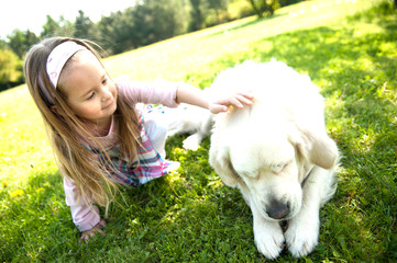 Best friends. Cute little girl with her golden retriever dog.